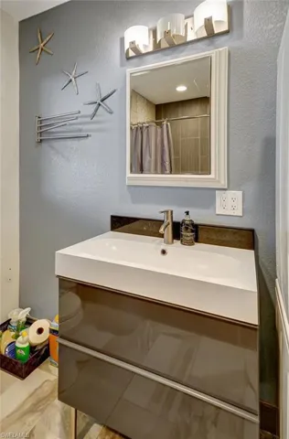 Mother-in-Law Suite:  Custom vanity with mirror & upgraded lighting