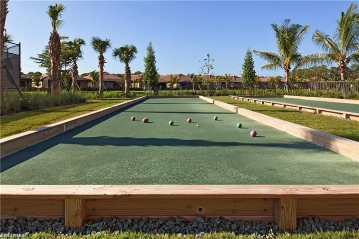 Surrounding community with a bocce ball area and a residential view