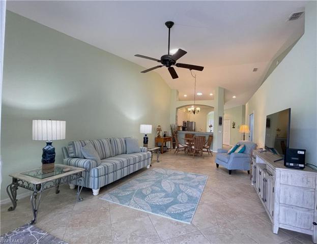 From spaceous living room you can see the dining area and kitchen