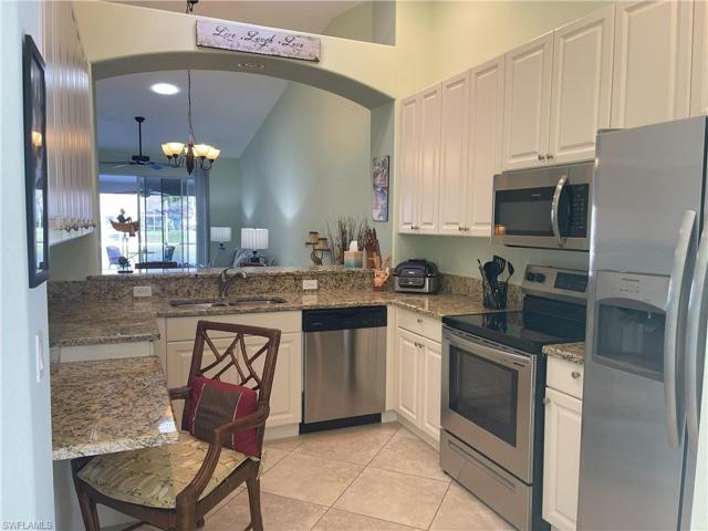 Kitchen has granite and newer stainless steel appliances