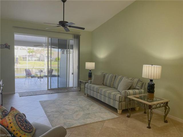 Living room looking out at lanai with lake view