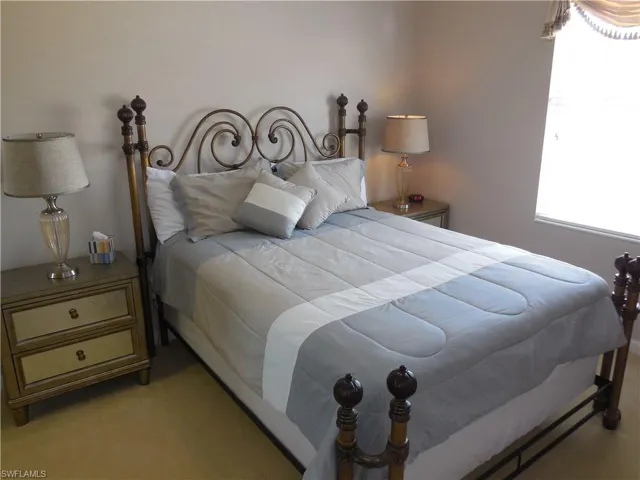 Bedroom with light carpet