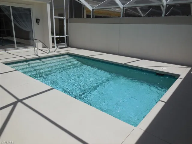 Outdoor pool featuring a patio area and a lanai