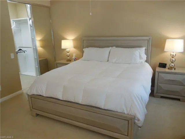 Carpeted bedroom with baseboards
