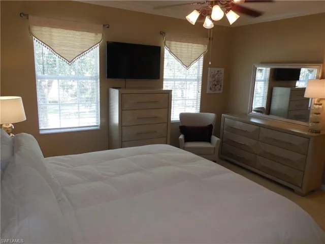 Bedroom featuring crown molding and ceiling fan