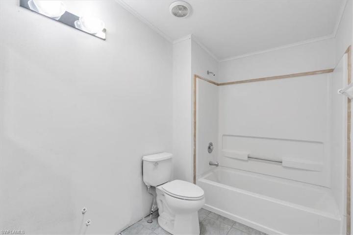 Spare bathroom standing at entry way