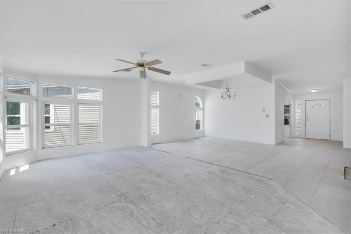 Standing in front of the back Florida room over looking the living room and dining/entry way