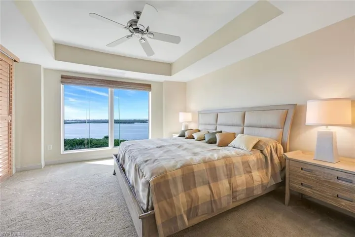 Tranquil bedroom featuring beautiful water vistas.