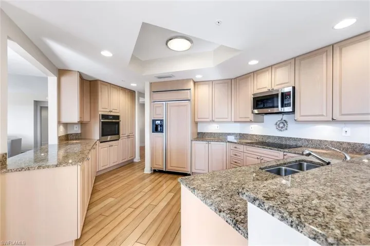 Well-designed kitchen with generous counter space and warm cabinetry, perfect for everyday cooking.