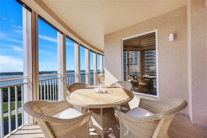 Bright outdoor dining spot with gorgeous views stretching over the golf course and water.
