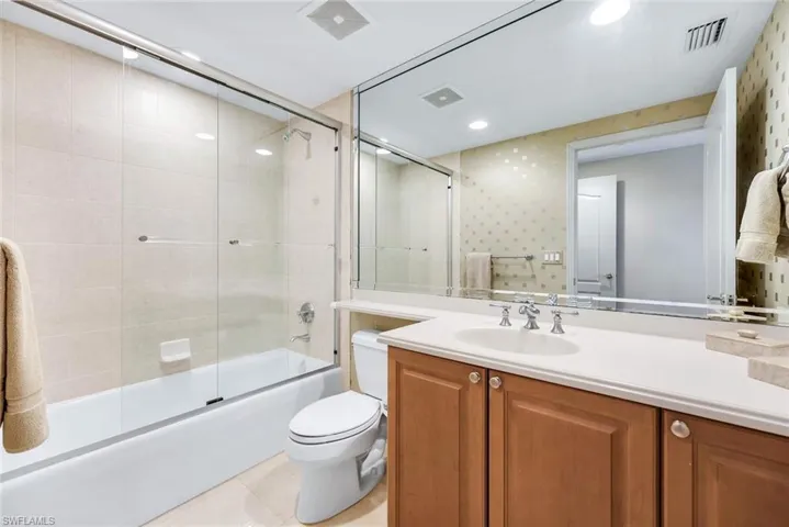 Well-appointed bathroom featuring a large vanity and a full tub/shower combo.