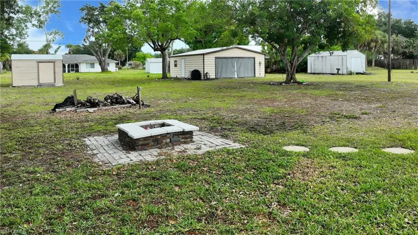 Outdoor fire pit with paver surround