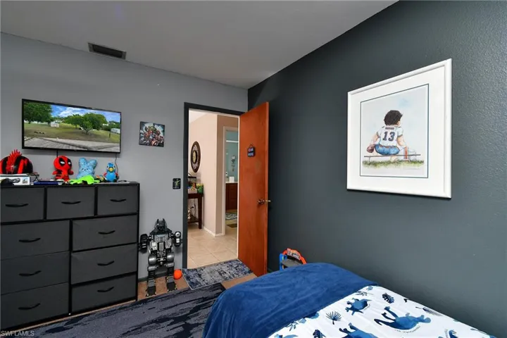 Interior room featuring two-tone painted walls and a wood-finish door