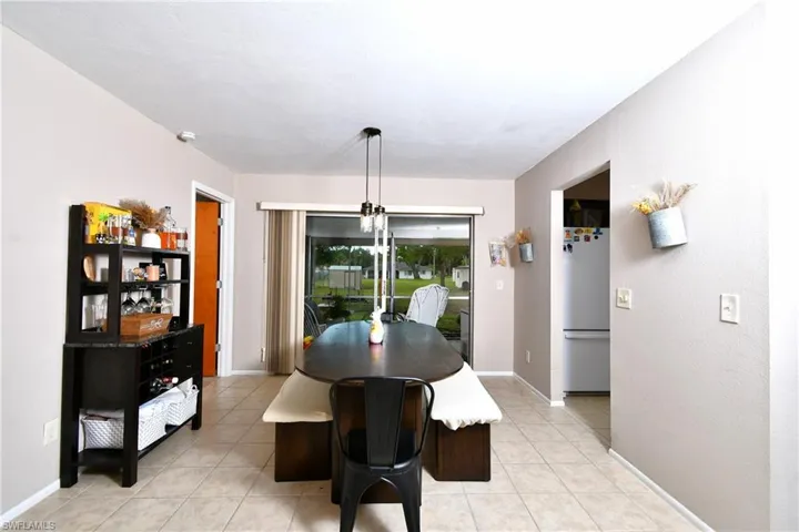 Dining area featuring neutral wall tones and tile flooring