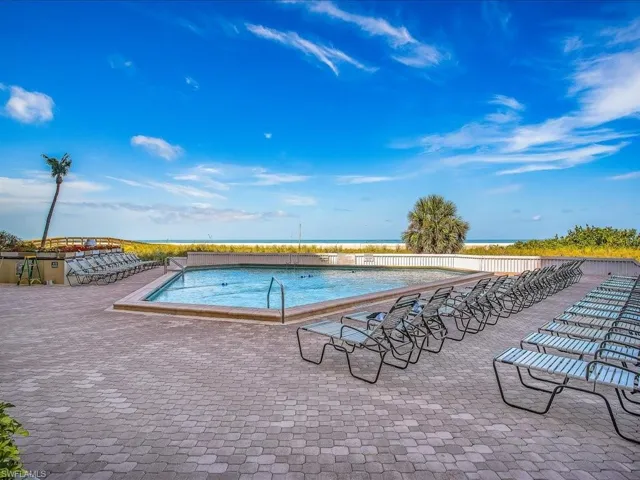 Community pool featuring a patio area