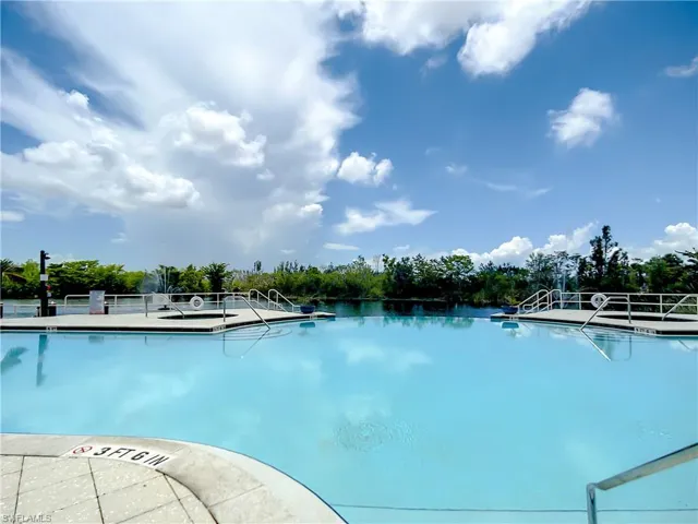 View of swimming pool with a water view