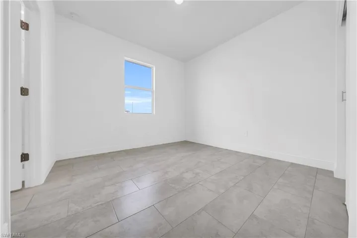 Spare room with baseboards