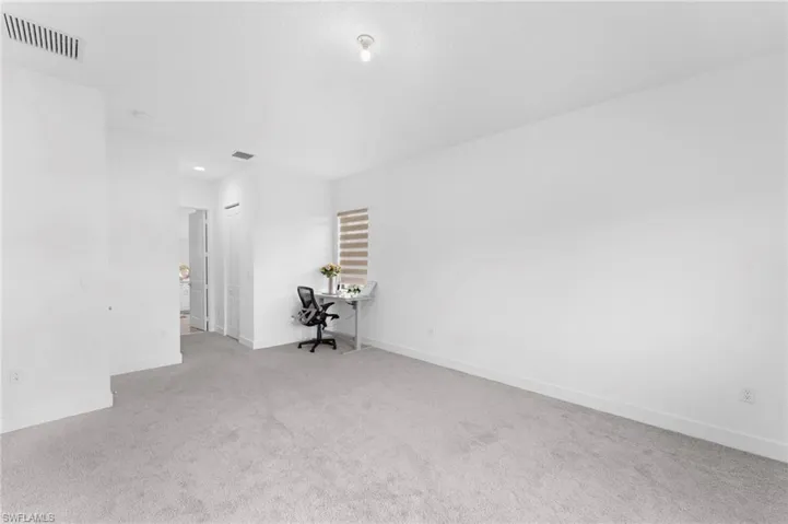 View of carpeted spare room