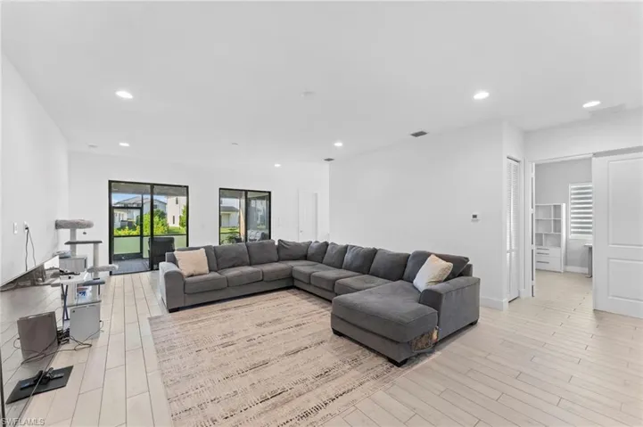 Living room with light hardwood / wood-style flooring