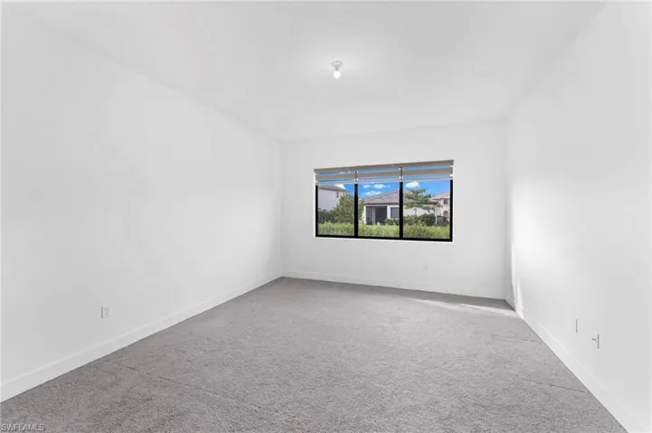 Spare room with carpet floors