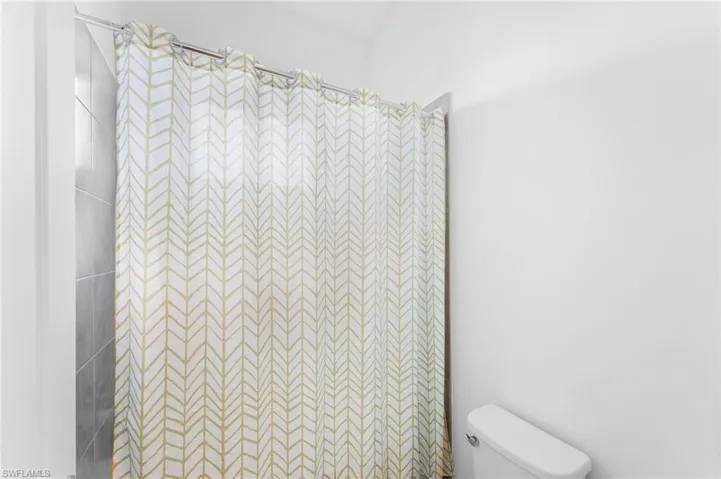 Bathroom featuring toilet and a shower