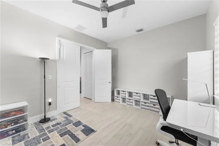 Office area featuring ceiling fan and light hardwood / wood-style flooring