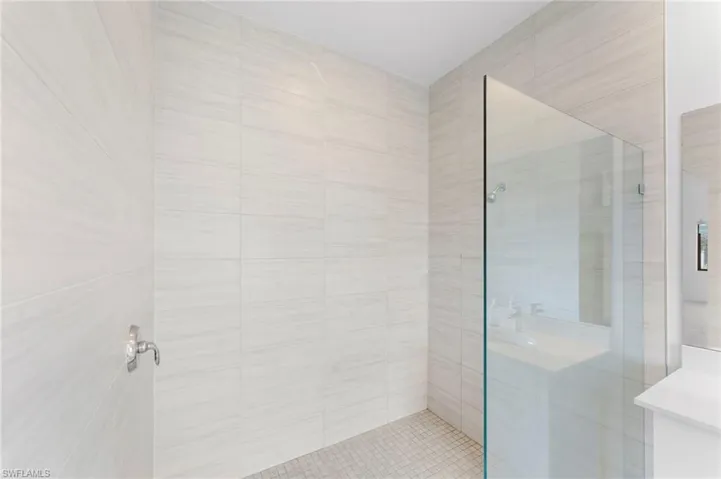 Bathroom with a shower with door
