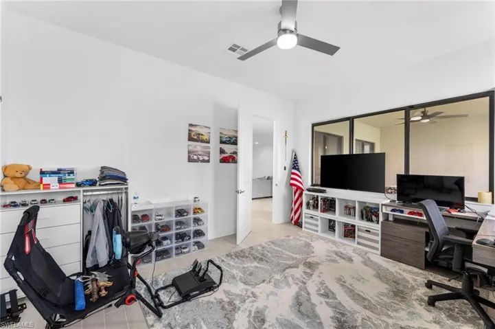 Office featuring light hardwood / wood-style floors and ceiling fan