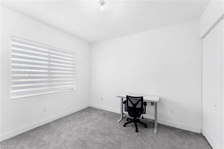 Unfurnished office with light carpet