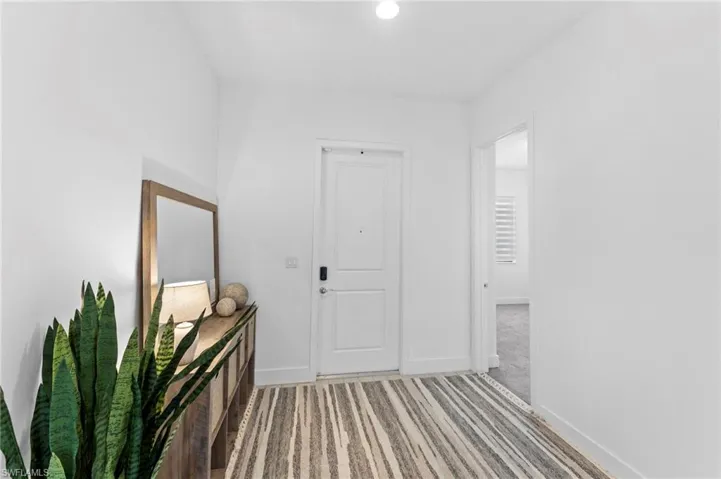 Corridor with carpet flooring