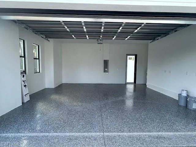 Garage featuring electric panel