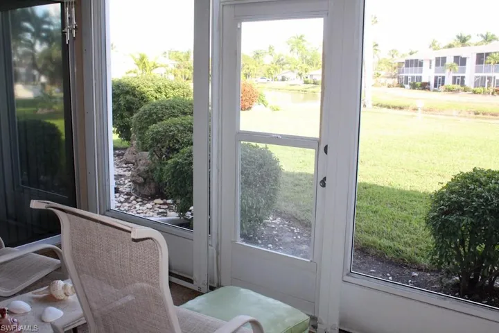 Doorway to outside featuring a water view