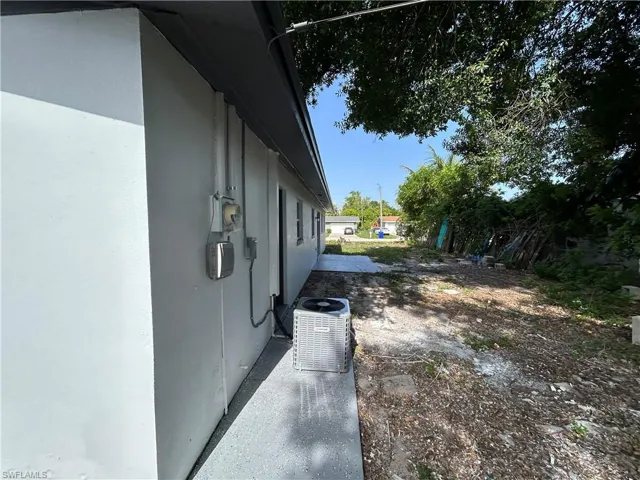 View of home's exterior with stucco siding and central air condition unit