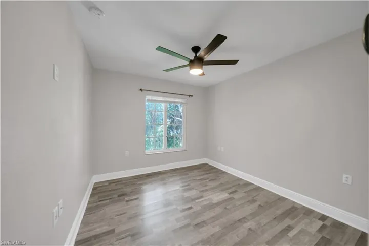 Unfurnished room with light wood-style floors and ceiling fan