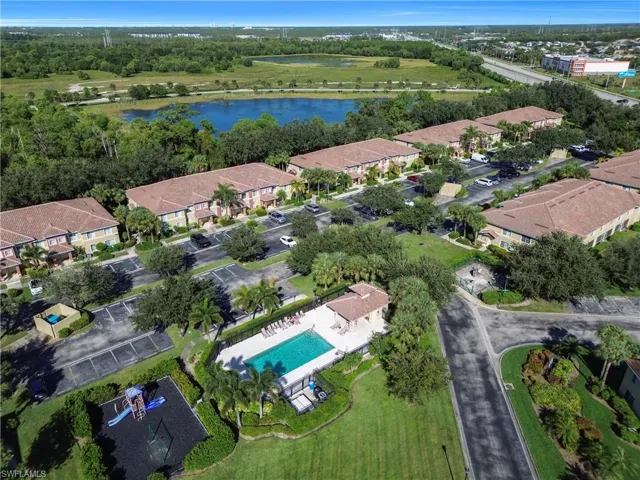 Aerial overview of property's location with nearby suburban area and a nearby body of water