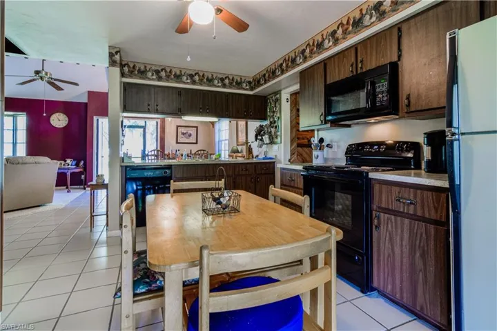 Warm And Homey Kitchen With Tiled Floors, Entry Into The Bonus Room With A Bar, Breakfast Bar Overlooking The Dining Area And Great Room.