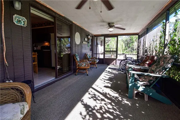 Large Screened Lanai With Over 250 Square Foot Of Living Space And Screen Doors On Either End For Easy Access To The Forest And The Private Lake. There are Ceiling Fans And Sliders To The Kitchen For Entertaining Convenience.