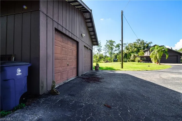 At The End Of The Winding Palm Tree Lined Driveway, Adjacent To The Home And A Circular Driveway There Is A Detached Garage With 3 Overhead Garage Doors Providing Room For Up To 4 Cars. Additionally, There Are Some 2nd Floor Storage Options Within This Versatile Secondary Building.