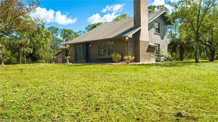 Lovely View Of The Front Of 11590 Fox Hill Rd Perfectly Situated In The Middle Of 5 Picturesque Acres Of Mature Landscaping.
