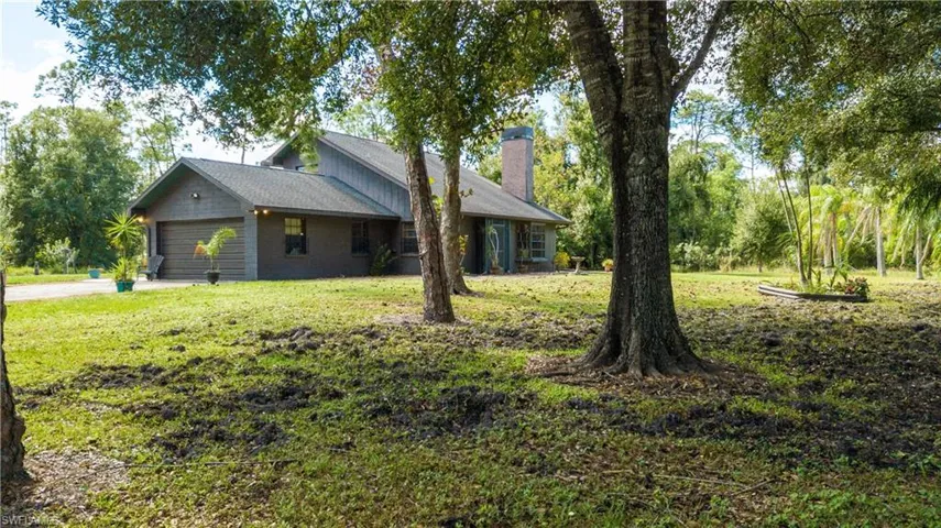 Lovely View Of The Front Of 11590 Fox Hill Rd Perfectly Situated In The Middle Of 5 Picturesque Acres Of Mature Landscaping.