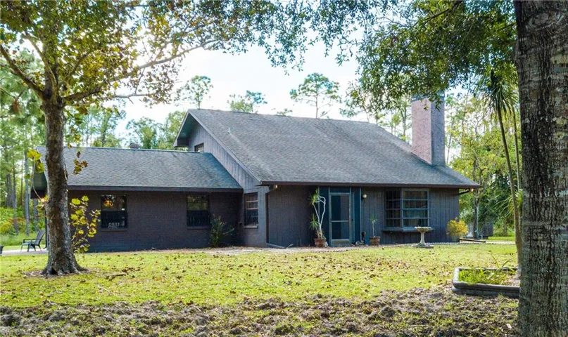 Lovely View Of The Front Of 11590 Fox Hill Rd Perfectly Situated In The Middle Of 5 Picturesque Acres Of Mature Landscaping.