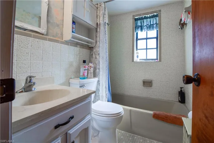 2nd Floor Full Bathroom With Beautiful Retro Style Tile Work And Shower/Tub Combination.