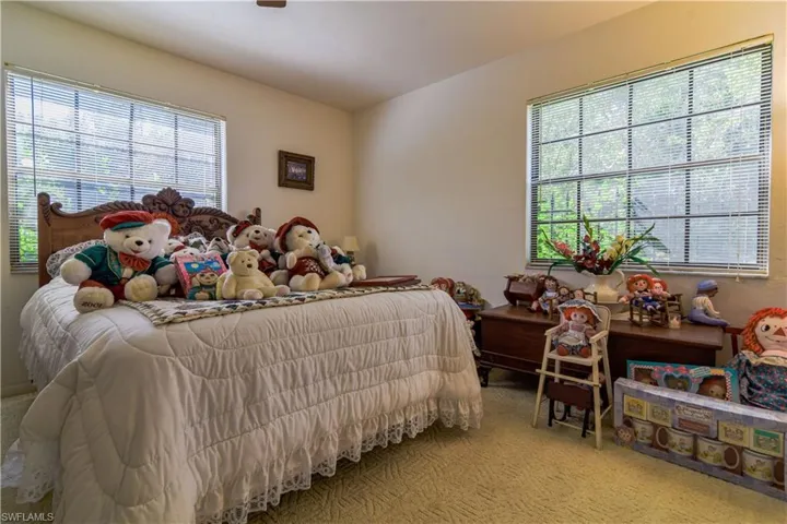 1st Floor Bedroom Tucked In At The Rear Of The Home For Privacy. 1st Floor Bathroom Conveniently Located Adjacent To The Bedroom Entrance. Large Windows Overlooking Woods And Views Of The Private Lake.