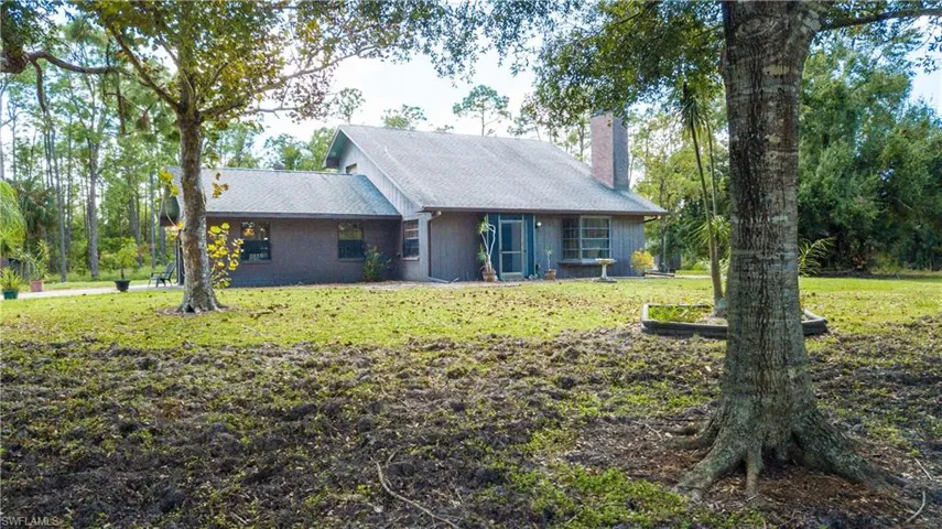 Lovely View Of The Front Of 11590 Fox Hill Rd Perfectly Situated In The Middle Of 5 Picturesque Acres Of Mature Landscaping.