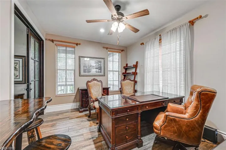 Office area featuring ceiling fan and light hardwood / wood-style flooring