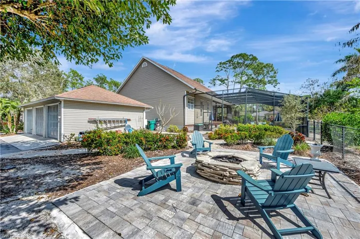 View of patio with an outdoor fire pit