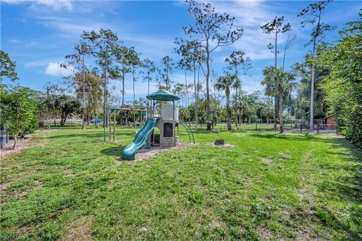View of play area with a yard