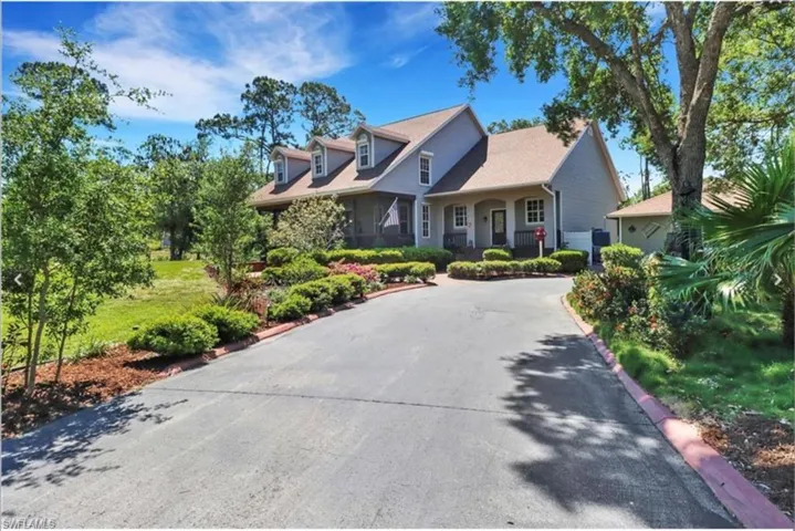 Cape cod home with a garage