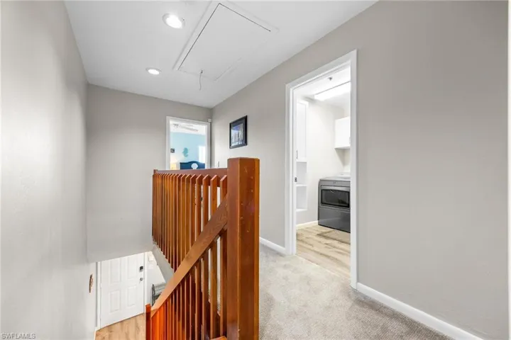 Hallway featuring washer / dryer