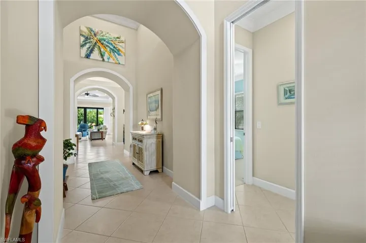 Corridor with light tile patterned floors